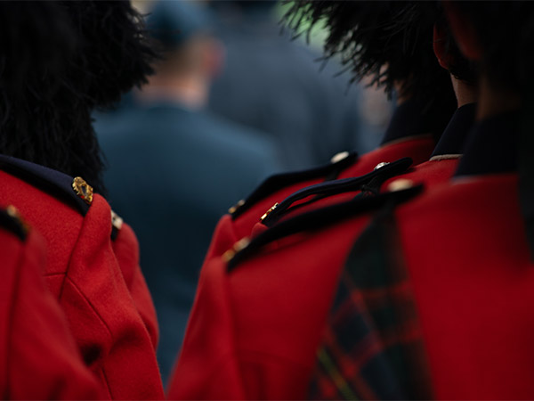 A photo of the shoulders of a parade member in a red uniform at the National Remembrance Day Ceremony in Ottawa.