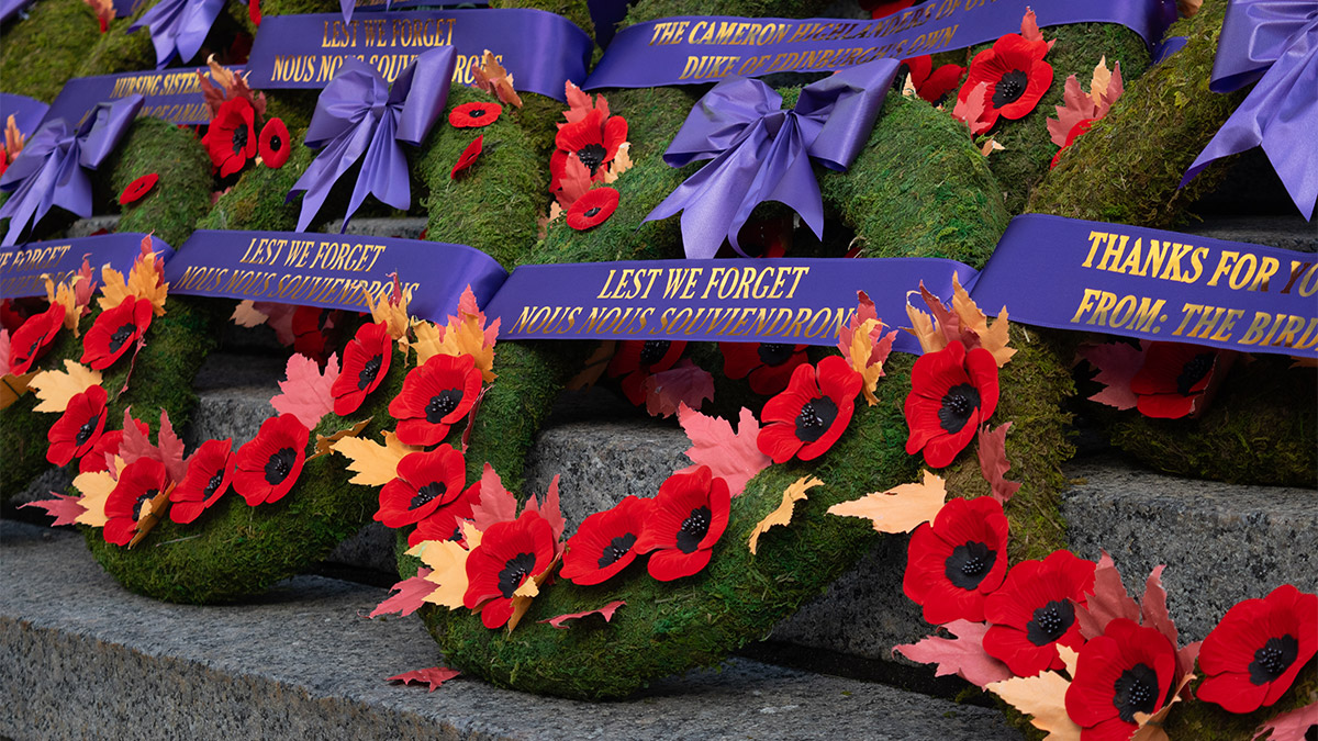 A wreath that reads “Lest we forget” sits among others on the Tomb of the Unknown Solider.