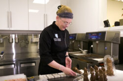 Chocolatier Anna Stubbe places the last remaining details onto her Easter bunny chocolates.