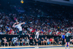 Canadian setter Luke Herr serving a volleyball in front of a crowd at TD Place.
