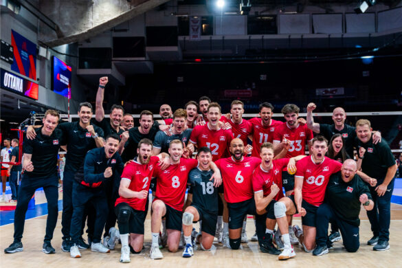 The Canadian Men's volleyball team celebrating after their win over Cuba.