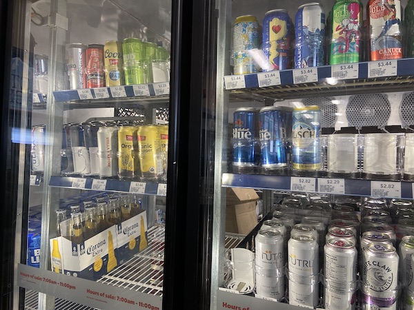 A walk-in cooler full of alcoholic beverages. 