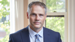 A headshot of Ottawa Lawyer Paul Champ in his office.