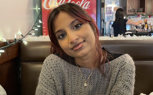 Ayesha Khan sits in a padded booth at Eddy's Diner.