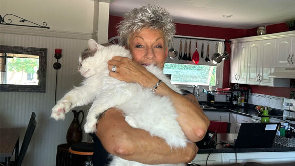 Janice Richard holding one of her rescue cats, Wookie.