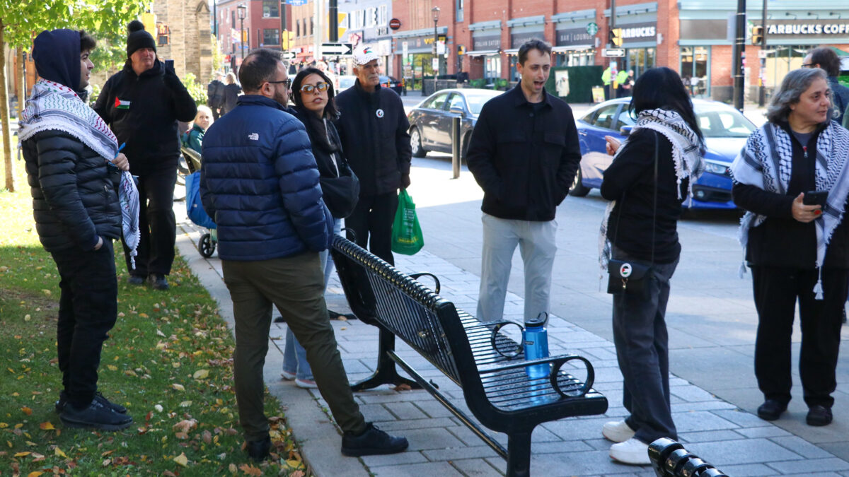 A man yells in the middle of a group of pro-Palestinian protesters