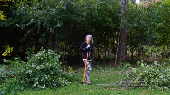 Sharon Boddy stands with a buckthorn extractor at Hampton Park.