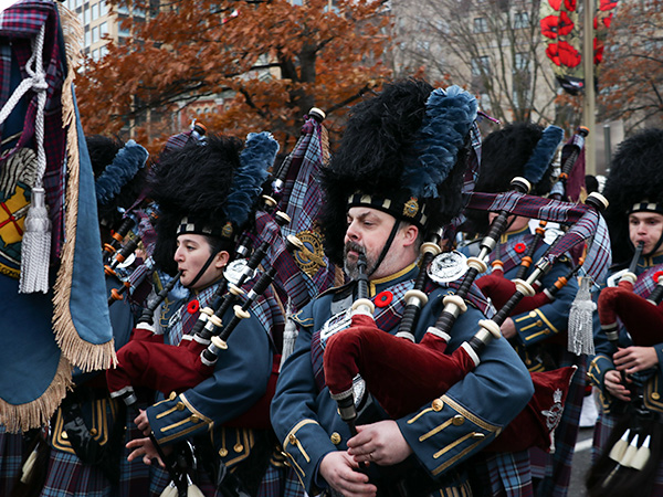 Parade members playing the bagpipes. 