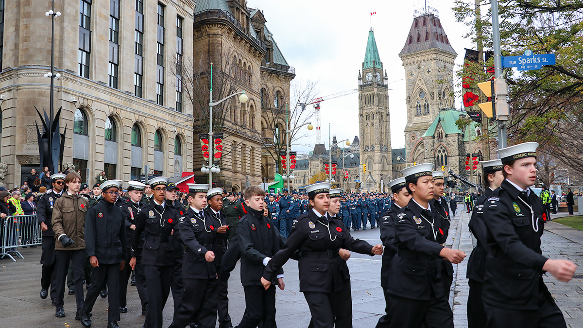 Cadets marching in the street in front of the Peace Tower in Ottawa during the National Remembrance Day Ceremony. 