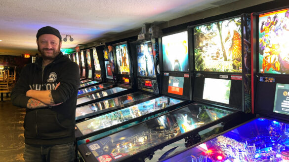 House of TARG owner, Mark McHale, poses in front of pinball machines at the House of TARG