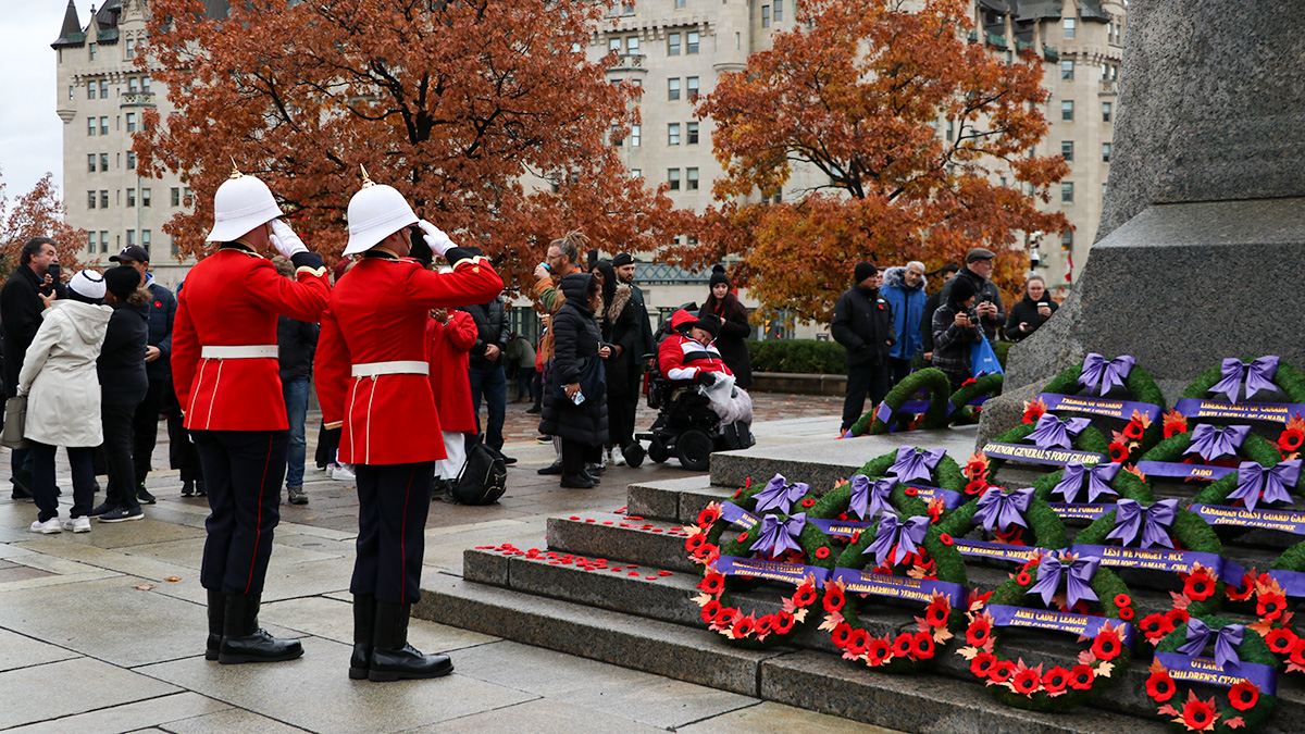 Royal Military College Cadets saluting and wreaths laying in front of the National War memorial. 