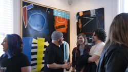 Colour blind artist Dave Fortier greets guests at his 2024 art exhibit "Colour Blind" at Ottawa's Urban Art Collective.