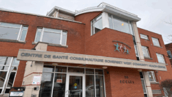 A red-brick multi-storey building with an overhead sign heading "Somerset West Community Health Centre." A logo with four colourful people figures under a grey arch sits above the heading. Canadian youth are more likely to view their mental health negatively than their parents.