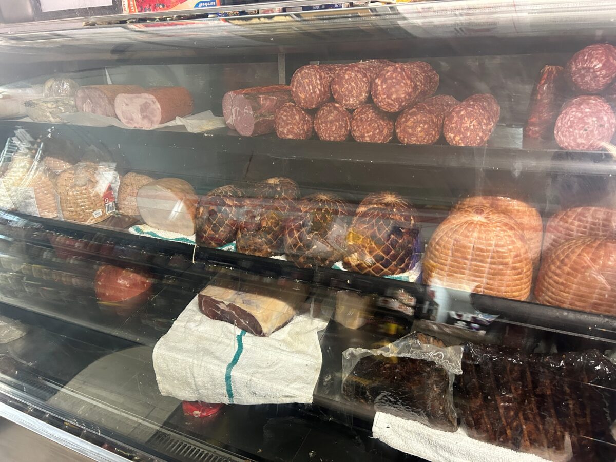 Di Rienzo's meat counter. A large selection of salami, ham, pork and other meats.