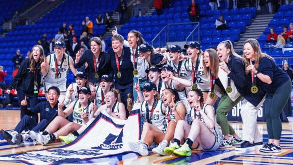 The University of Saskatchewan women's basketball team celebrating their championship win.