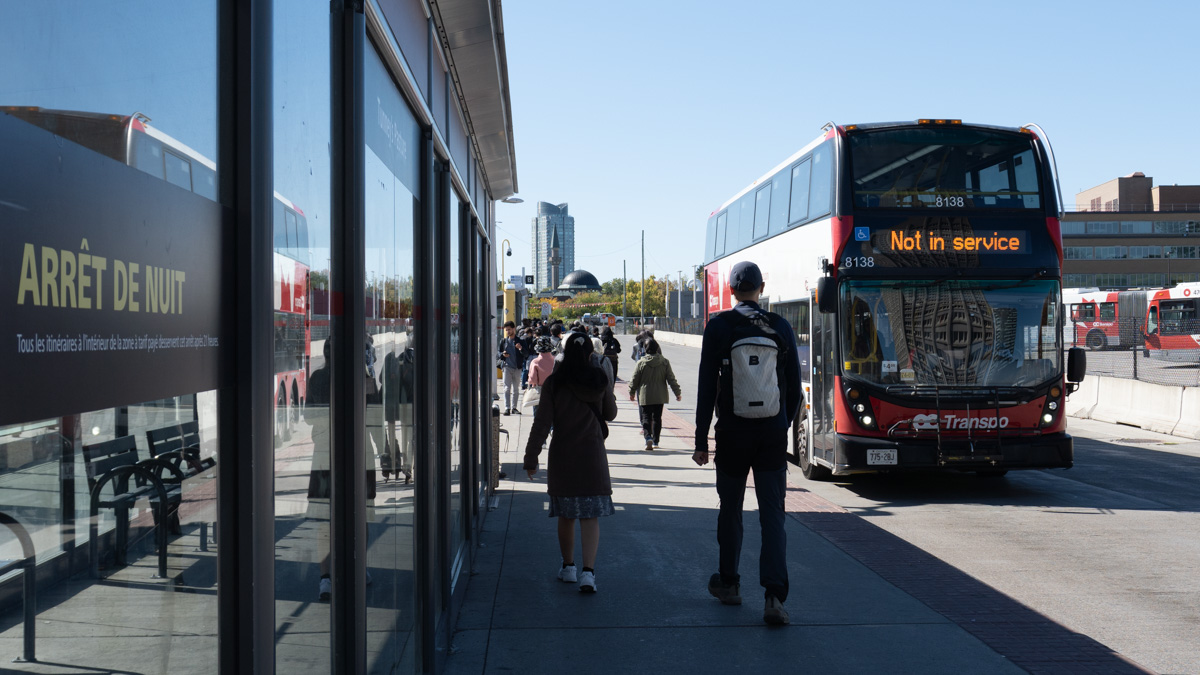 A "Not in service" bus driving past Tunney's Pasture station.